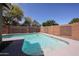 Backyard pool with privacy fencing and mature trees at 12845 W Milton Dr, Peoria, AZ 85383