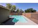 Backyard pool with privacy fencing and mature trees at 12845 W Milton Dr, Peoria, AZ 85383