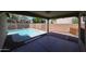 Covered patio overlooks a refreshing pool surrounded by block fencing at 12845 W Milton Dr, Peoria, AZ 85383