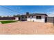 Backyard featuring a gravel area, small patch of artificial turf and a home exterior at 1539 W 5Th St, Tempe, AZ 85281