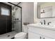 Updated bathroom boasts modern finishes, including a stylish vanity and glass-enclosed shower at 1539 W 5Th St, Tempe, AZ 85281