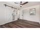 Bedroom featuring ceiling fan, closet space, and ensuite bath at 1539 W 5Th St, Tempe, AZ 85281
