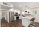 Gorgeous kitchen features stainless steel appliances, updated cabinetry and breakfast bar at 1539 W 5Th St, Tempe, AZ 85281