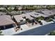 An aerial view of a single Gathering home that features a landscaped front yard and an attached two-car garage at 16083 W Cambridge Ave, Goodyear, AZ 85395
