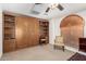 Bedroom with Murphy bed and built-in shelving providing ample storage and functionality at 16083 W Cambridge Ave, Goodyear, AZ 85395