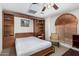 Bedroom with Murphy bed lowered and built-in shelving providing ample storage and functionality at 16083 W Cambridge Ave, Goodyear, AZ 85395