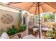 Inviting outdoor patio area with comfortable seating under a large umbrella at 16083 W Cambridge Ave, Goodyear, AZ 85395