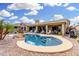 Backyard pool area offering a serene escape with a beautifully shaped pool and lounge chairs at 16083 W Cambridge Ave, Goodyear, AZ 85395