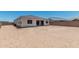 Large backyard with block wall and covered patio, ready for landscaping and outdoor living at 16494 W Creedance Blvd, Surprise, AZ 85387