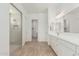 Modern bathroom features a glass shower and a double vanity at 16494 W Creedance Blvd, Surprise, AZ 85387