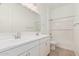 Bright bathroom with double sink vanity, large mirror, and tub shower combo at 16494 W Creedance Blvd, Surprise, AZ 85387
