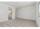Bright bedroom features cozy carpeting and a connected bathroom and walk-in closet at 16494 W Creedance Blvd, Surprise, AZ 85387