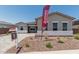 Attractive single-story home showcasing a gravel yard and 'available special financing' sign at 16494 W Creedance Blvd, Surprise, AZ 85387