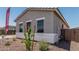 Side view of a home featuring a neutral color palette with desert landscaping and available financing at 16494 W Creedance Blvd, Surprise, AZ 85387