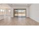 Bright living area with sliding glass doors, light flooring, and open space at 16494 W Creedance Blvd, Surprise, AZ 85387