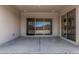 Covered patio featuring a concrete slab and sliding glass doors leading inside at 16494 W Creedance Blvd, Surprise, AZ 85387