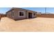 Expansive backyard featuring block wall, covered patio, and abundant space for outdoor activities and customization at 16550 W Creedance Blvd, Surprise, AZ 85387