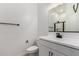 Bathroom features a white vanity with black fixtures and a shower with black trim at 16550 W Creedance Blvd, Surprise, AZ 85387