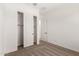 Neutral bedroom with closet and entrance to another room at 16550 W Creedance Blvd, Surprise, AZ 85387