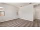 Carpeted bedroom with white walls and window with blinds at 16550 W Creedance Blvd, Surprise, AZ 85387