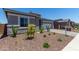 Charming single-story home with well-manicured landscaping at 16550 W Creedance Blvd, Surprise, AZ 85387