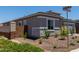 Corner lot featuring desert landscaping, stone veneer accents, and well-maintained curb appeal at 16550 W Creedance Blvd, Surprise, AZ 85387