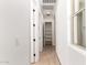 Hallway features tile flooring, window and multiple doors at 16550 W Creedance Blvd, Surprise, AZ 85387