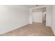 Open living room with bright natural light, neutral walls, and tile flooring at 16550 W Creedance Blvd, Surprise, AZ 85387