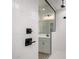 Close-up of the shower featuring white subway tile and black hardware at 16550 W Creedance Blvd, Surprise, AZ 85387