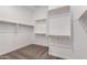 Spacious walk-in closet with carpeted flooring and lots of wooden shelving at 16550 W Creedance Blvd, Surprise, AZ 85387