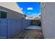 Backyard featuring a simple gravel area and a gray block wall at 16840 W Monroe St, Goodyear, AZ 85338
