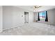 Open bonus room with plush carpeting, recessed lighting and bright natural light at 16840 W Monroe St, Goodyear, AZ 85338