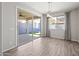 Bright dining room with sliding glass doors to the patio at 16840 W Monroe St, Goodyear, AZ 85338