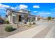 Attractive two-story residence displaying a two-car garage, desert landscaping, and a welcoming covered porch at 16840 W Monroe St, Goodyear, AZ 85338