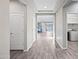 Hallway leading to a laundry room at 16840 W Monroe St, Goodyear, AZ 85338
