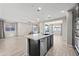 Open floor plan featuring modern kitchen with stainless steel appliances at 16840 W Monroe St, Goodyear, AZ 85338