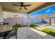 Beautiful outdoor patio with a dining area, an in-ground pool and lush landscaping at 16840 W Monroe St, Goodyear, AZ 85338