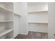Spacious walk-in closet features built-in shelving and ample storage space at 16840 W Monroe St, Goodyear, AZ 85338