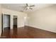 Spacious bedroom with wood-look floors and access to a closet and bathroom at 16848 W Rimrock St, Surprise, AZ 85388