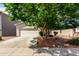 Charming single-Gathering house with a large tree and well-maintained lawn at 16848 W Rimrock St, Surprise, AZ 85388