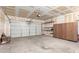 Spacious garage with storage cabinets and shelving units at 16848 W Rimrock St, Surprise, AZ 85388