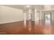 Spacious living room with hardwood floors, ceiling fan, and sliding glass doors at 16848 W Rimrock St, Surprise, AZ 85388