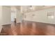 Open-concept living area with hardwood floors, plenty of natural light, and neutral walls at 16848 W Rimrock St, Surprise, AZ 85388