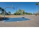 This community basketball court features multiple hoops and well-maintained playing surfaces at 1718 S Longmore -- # 95, Mesa, AZ 85202
