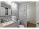 Well-lit bathroom featuring a vanity with a modern faucet, complemented by a convenient toilet room at 1718 S Longmore -- # 95, Mesa, AZ 85202