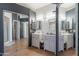 This bathroom features a double sink vanity and a separate shower, offering modern convenience at 1718 S Longmore -- # 95, Mesa, AZ 85202
