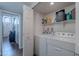 Convenient laundry room equipped with a washer, dryer, and shelving for efficient storage and organization at 1718 S Longmore -- # 95, Mesa, AZ 85202