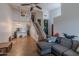 Open living room with tile floors, high ceilings, and staircase leading to the second floor at 1718 S Longmore -- # 95, Mesa, AZ 85202