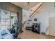 Second view of office/flex space showcasing the stairs and view through to the living room at 1718 S Longmore -- # 95, Mesa, AZ 85202