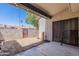 This covered patio has a privacy wall that offers a secluded outdoor space for dining or relaxation at 1718 S Longmore -- # 95, Mesa, AZ 85202
